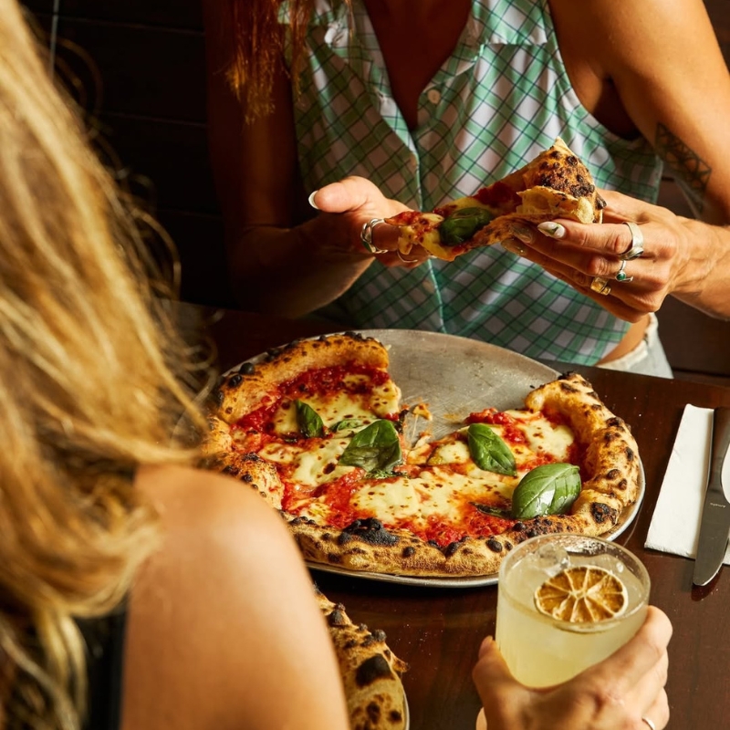 girls eating pizza